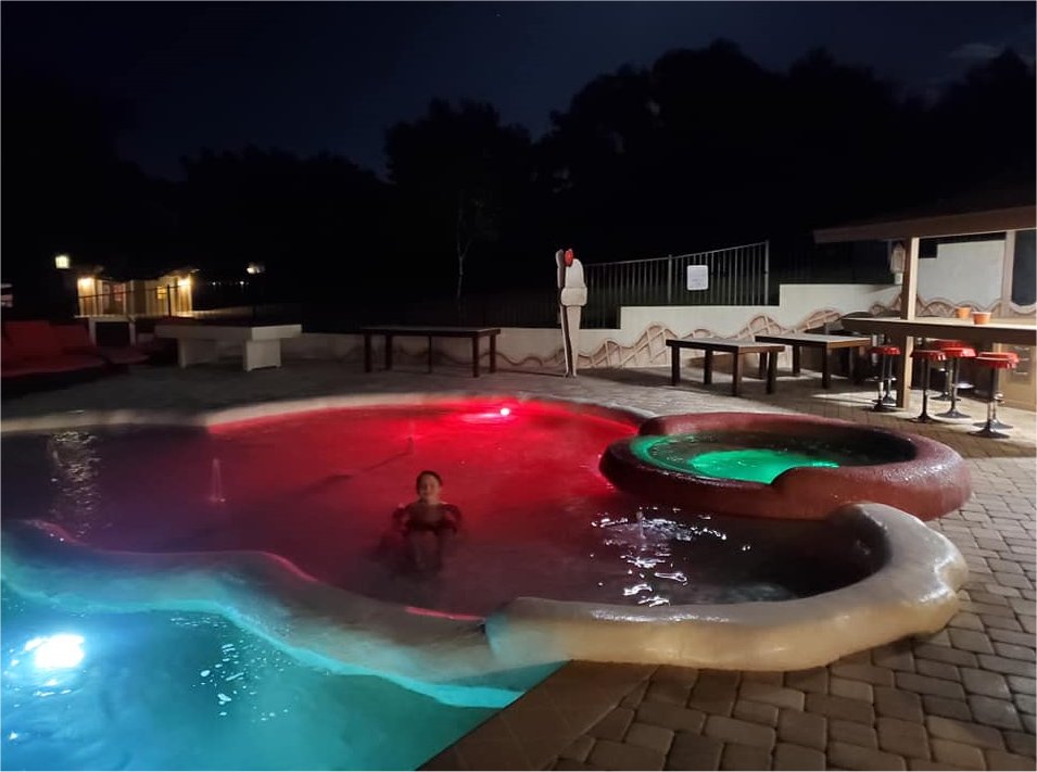 watch movies at the pool in this luxury vacation rental