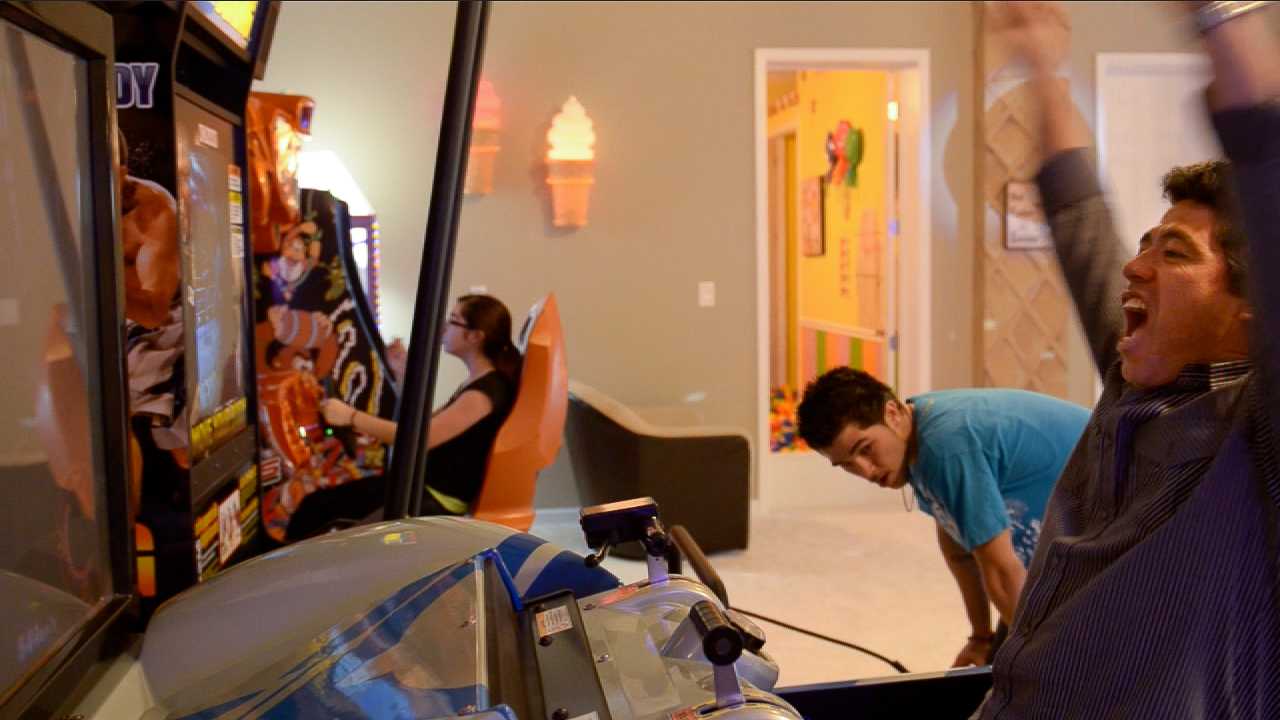 Play video games at the arcade in the Sweet Escape vacation home rental outside of Orlando!